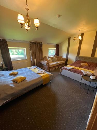เตียงในห้องที่ Vila Forest Resort