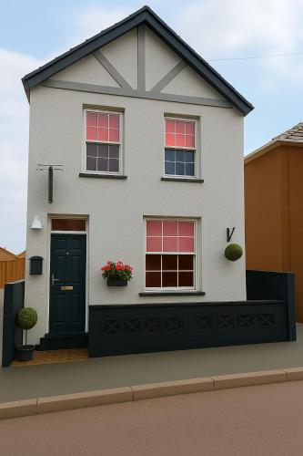 a rendering of a white house at The Railway Sleeper Lodge in Colchester