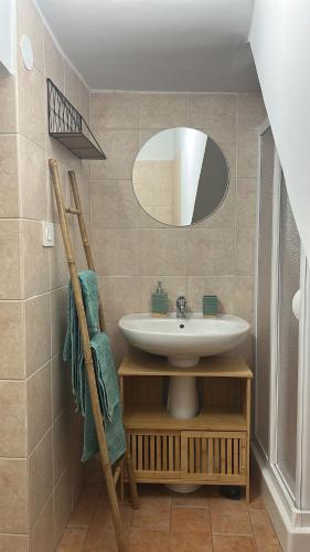 a bathroom with a sink and a mirror at Casa Ale in Bisceglie
