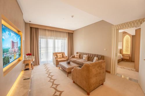a living room with a couch and a table at World Heart Hotel in Baghdad