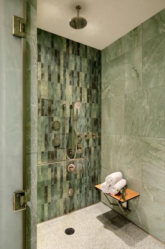 a bathroom with a shower with a tub at The Ritz-Carlton, Laguna Niguel in Dana Point
