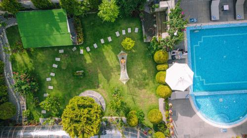 an overhead view of a garden with a swimming pool at Temple Himalaya Hotel & Spa in Pokhara