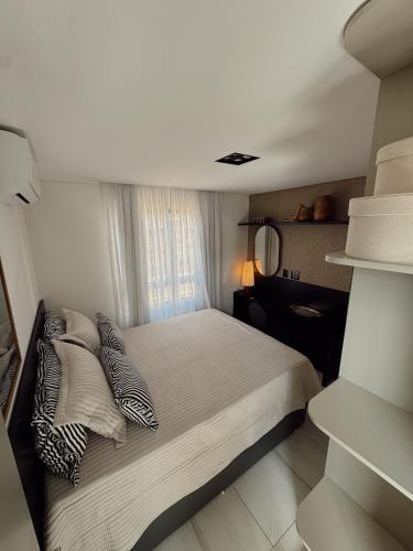 Ένα ή περισσότερα κρεβάτια σε δωμάτιο στο Luxuosa Cobertura em Cabo Branco