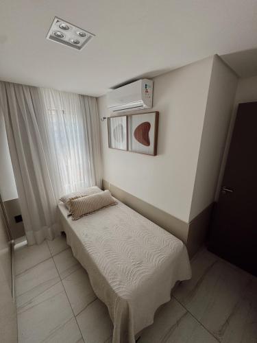 Ένα ή περισσότερα κρεβάτια σε δωμάτιο στο Luxuosa Cobertura em Cabo Branco