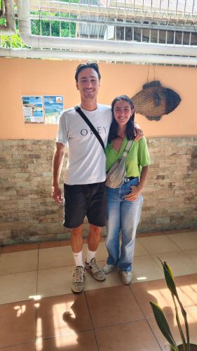 a man and a woman posing for a picture at Little Norway Guesthouse - Mactan Cebu International Airport in Mactan