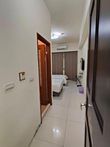 a corridor of a hospital room with two beds at 馥芯莟旅棧 in Nangan Airport