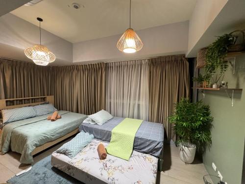 Katil atau katil-katil dalam bilik di BGC 3BR Uptown Parksuites with bathtub 16