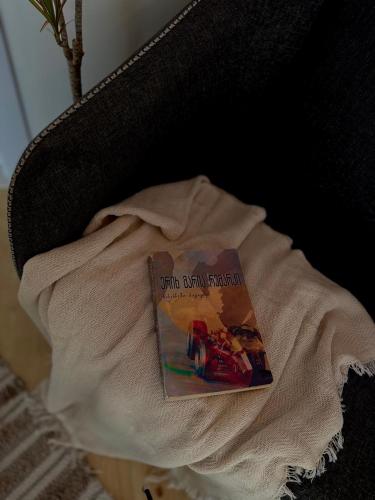 a book is sitting on top of a table at Utopia Inn უტოპია ინნ in Batumi