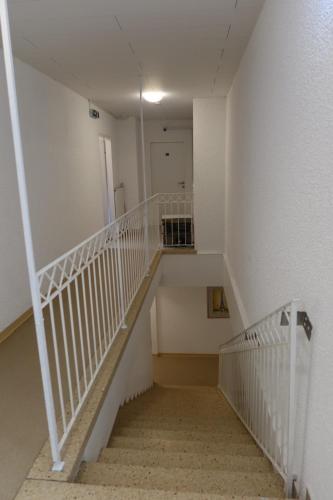 an empty staircase in a building with a stair case at La Veneziana Guesthouse in Aschach an der Donau