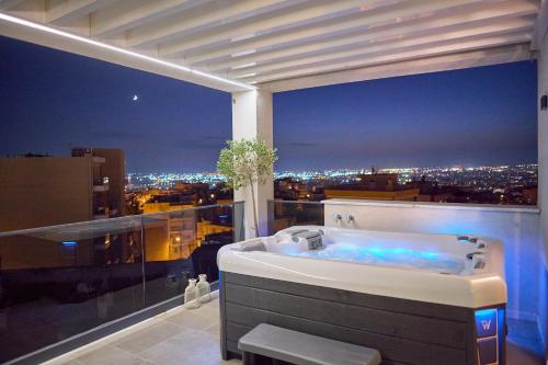 a bath tub sitting on top of a building at SIGMA Suites Hotel in Thessaloniki