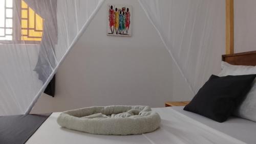 Ένα ή περισσότερα κρεβάτια σε δωμάτιο στο Maku House