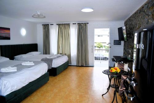 Katil atau katil-katil dalam bilik di The Queenslander Motel