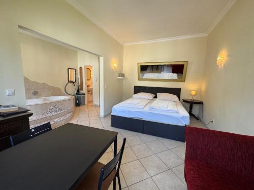a hotel room with a bed and a bathroom at Cologne Apartments, direkt am Dom Zentrum 3 Zimmer Studio 46 qm in Cologne