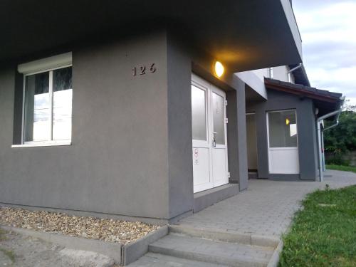 a house with a number on the side of it at Omega Szigetszentmiklós in Szigetszentmiklós