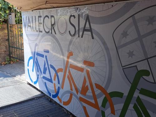 a wall with a painting of a bike on it at Sandra Camporosso in Camporosso