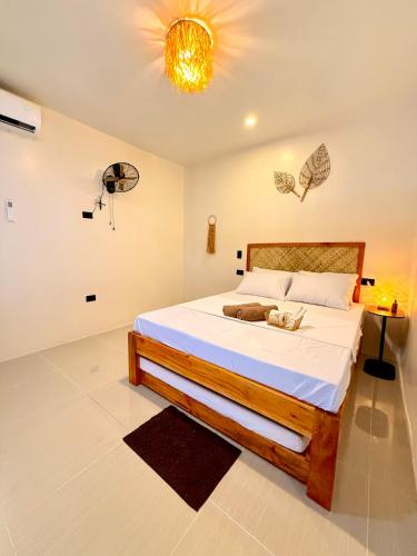 Postel nebo postele na pokoji v ubytování Isla Cuatro Siargao - Starlink