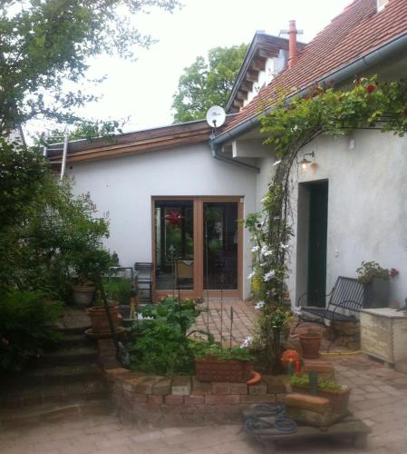 a small white house with a patio at Quiet Retreat im Weinviertel 