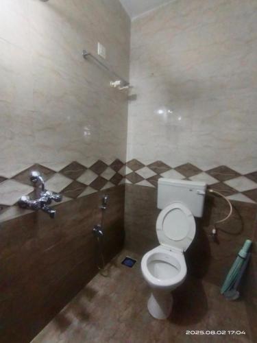 a bathroom with a toilet and a sink at INDRA'S NEST - Studio Apartments Previously No Name Guest House in Arambol