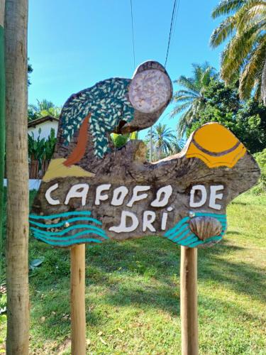 a sign for a seafood district with a fish on it at Cafofo de Dri in Ilha de Boipeba