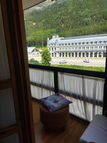 a balcony with a view of a large building at El Mirador de la Estación in Canfranc-Estación