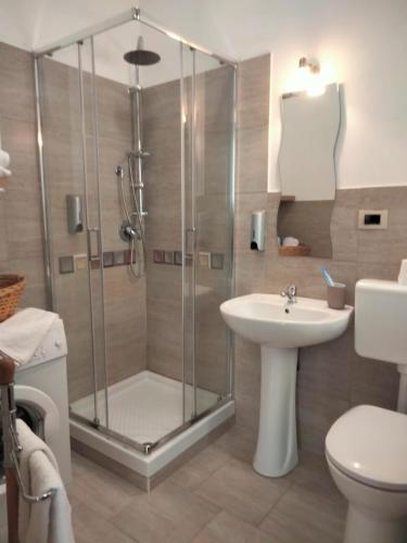 a bathroom with a shower and a sink at Casa Via Roma in Siculiana