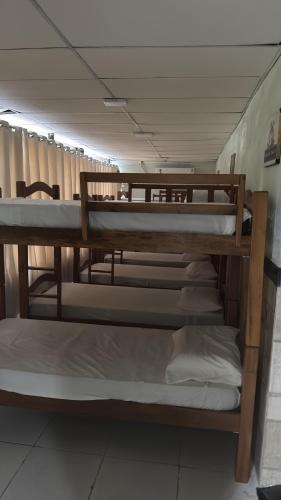a group of bunk beds in a room at Pousada Alameda Boa Vista in Recife
