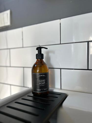 a bottle of soap sitting on top of a counter at Cedori Butik Otel in Ezine