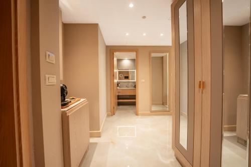 a hallway with a door leading to a room at World Heart Hotel in Baghdad
