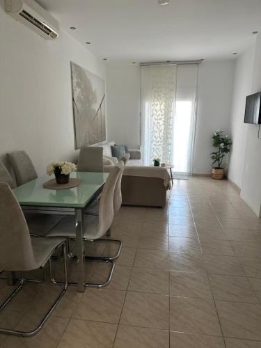 a living room with a table and a couch at Villa Niki in Vrasná