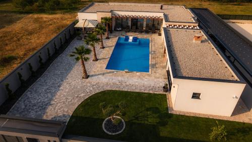 an overhead view of a swimming pool on a house at Villa River in Mostar