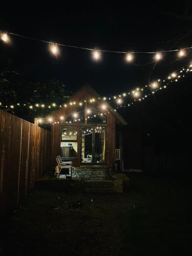 a house with lights on it at night at The Nest bed and garden in Varberg