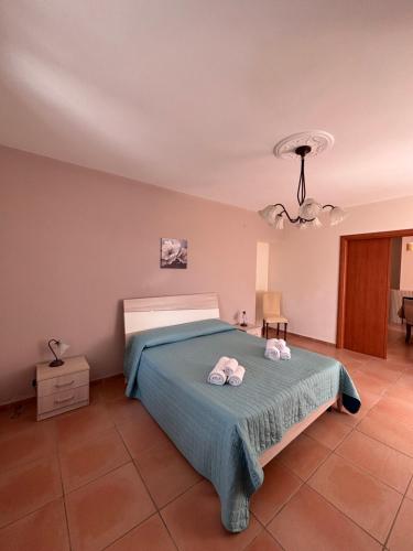 a bedroom with a bed with two towels on it at B&B La Terrazza in Mormanno