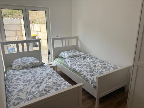 Ένα ή περισσότερα κρεβάτια σε δωμάτιο στο Ferienhaus Kölzer Weg Erdgeschoss mit E-Auto Ladestation