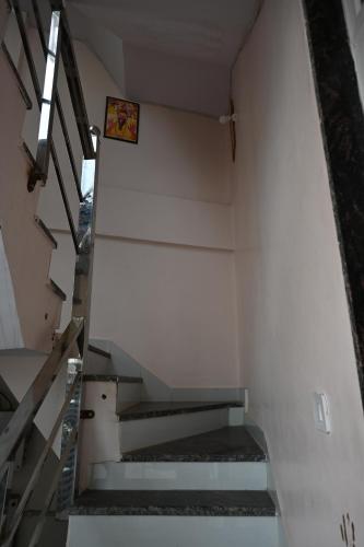 a set of stairs in an empty building at Shree Jee Hotels in Vrindāvan