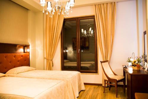 Postel nebo postele na pokoji v ubytování Oxford hotel
