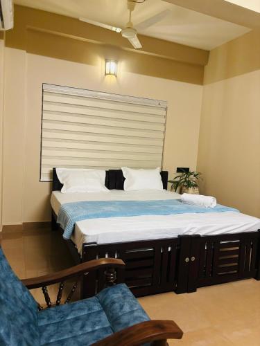 a large bed in a room with a window at Venice villa varkala cliff -luxurious rooms and apartments in Varkala
