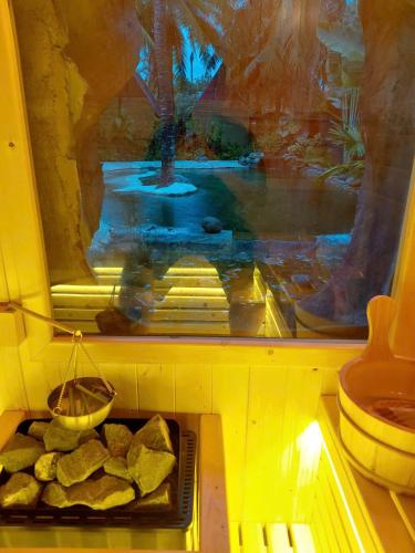 a room with a tray of food on a table at Onsen Cóc Retreat in My Tho