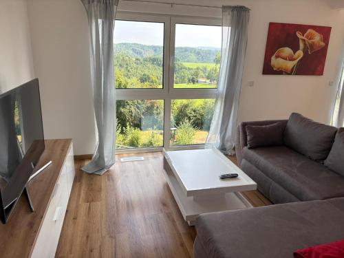 Χώρος καθιστικού στο Ferienhaus Kölzer Weg Obergeschoss mit Ladestation