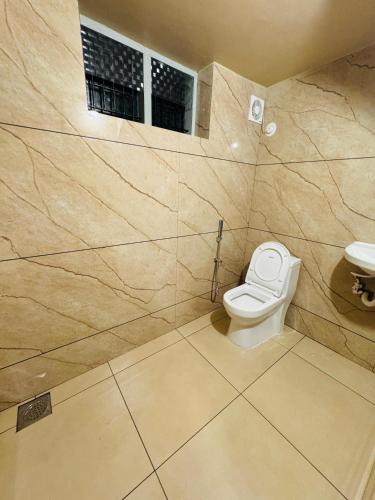 a bathroom with a toilet and a sink at Venice villa varkala cliff -luxurious rooms and apartments in Varkala
