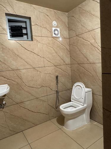 a bathroom with a toilet and a shower stall at Venice villa varkala cliff -luxurious rooms and apartments in Varkala