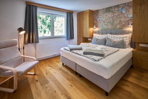 Ένα ή περισσότερα κρεβάτια σε δωμάτιο στο Apartments Hohenberger Mallnitz - Mein Platz in den Bergen!