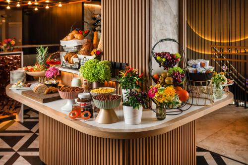 a buffet of food on a table in a store at Wings Plaza in Kraków