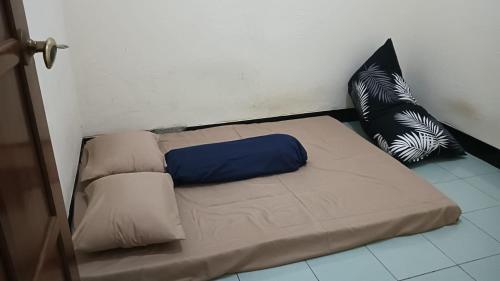 Katil atau katil-katil dalam bilik di AL Homestay