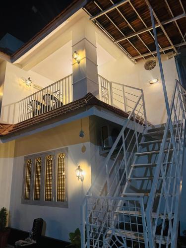 a staircase leading up to a house at Venice villa varkala cliff -luxurious rooms and apartments in Varkala