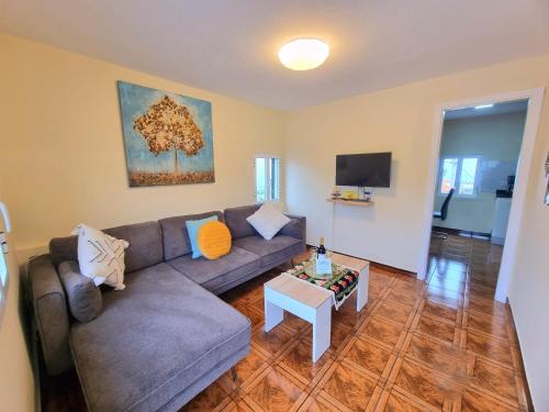 a living room with a couch and a table at Santana Madeira Hiking Getaway near Pico Ruivo and Levadas Base in Santana