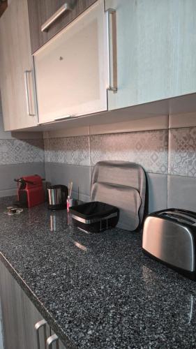 a kitchen with a counter top with a sink at Apartamientos edificio mekad in Oued Laou