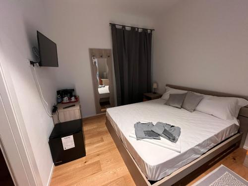 Ένα ή περισσότερα κρεβάτια σε δωμάτιο στο Terra Buona Rooms