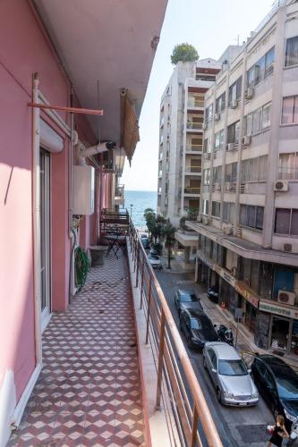 a balcony of a building with a view of the ocean at Aristoteluos By the Sea in Thessaloniki