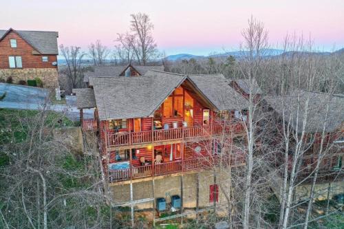 an aerial view of a house with a large deck at All Ya Need cabin in Seaton Spring