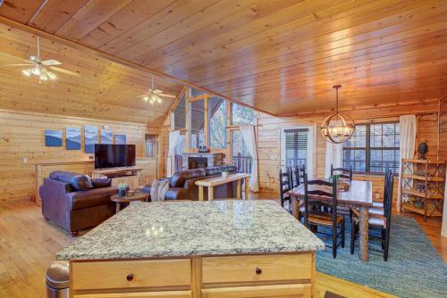 a kitchen and living room with a couch and a table at All Ya Need cabin in Seaton Spring